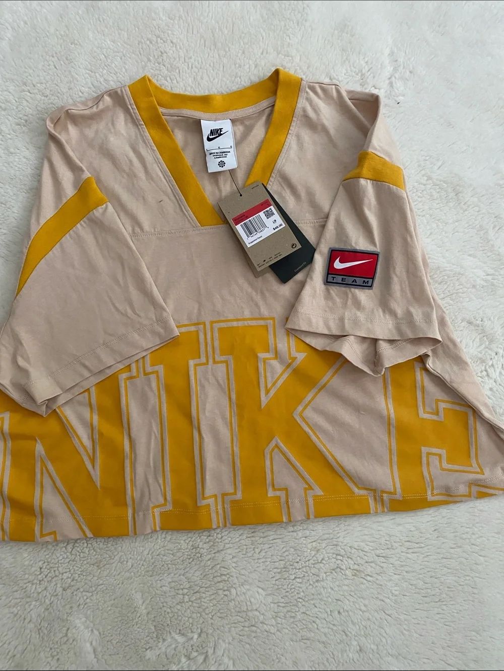 Nike Beige Cropped V-Neck Top with Yellow Logo and Trim